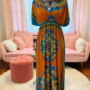 Beautiful & vibrantly colored maxi dress. Fit a size 12 thru 16. One of a kind!